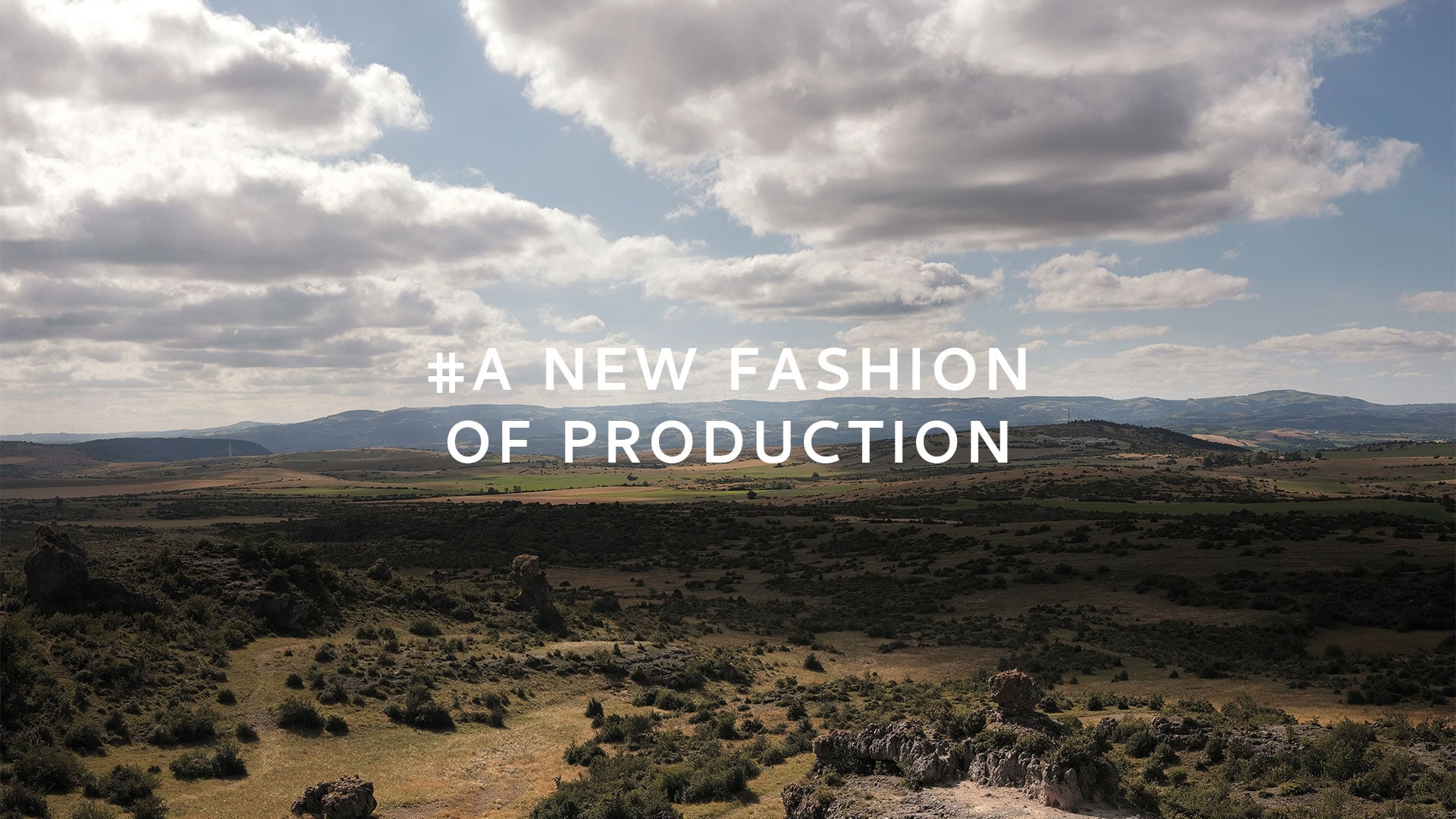 Bleu de Chauffe slogan on a Larzac landscape