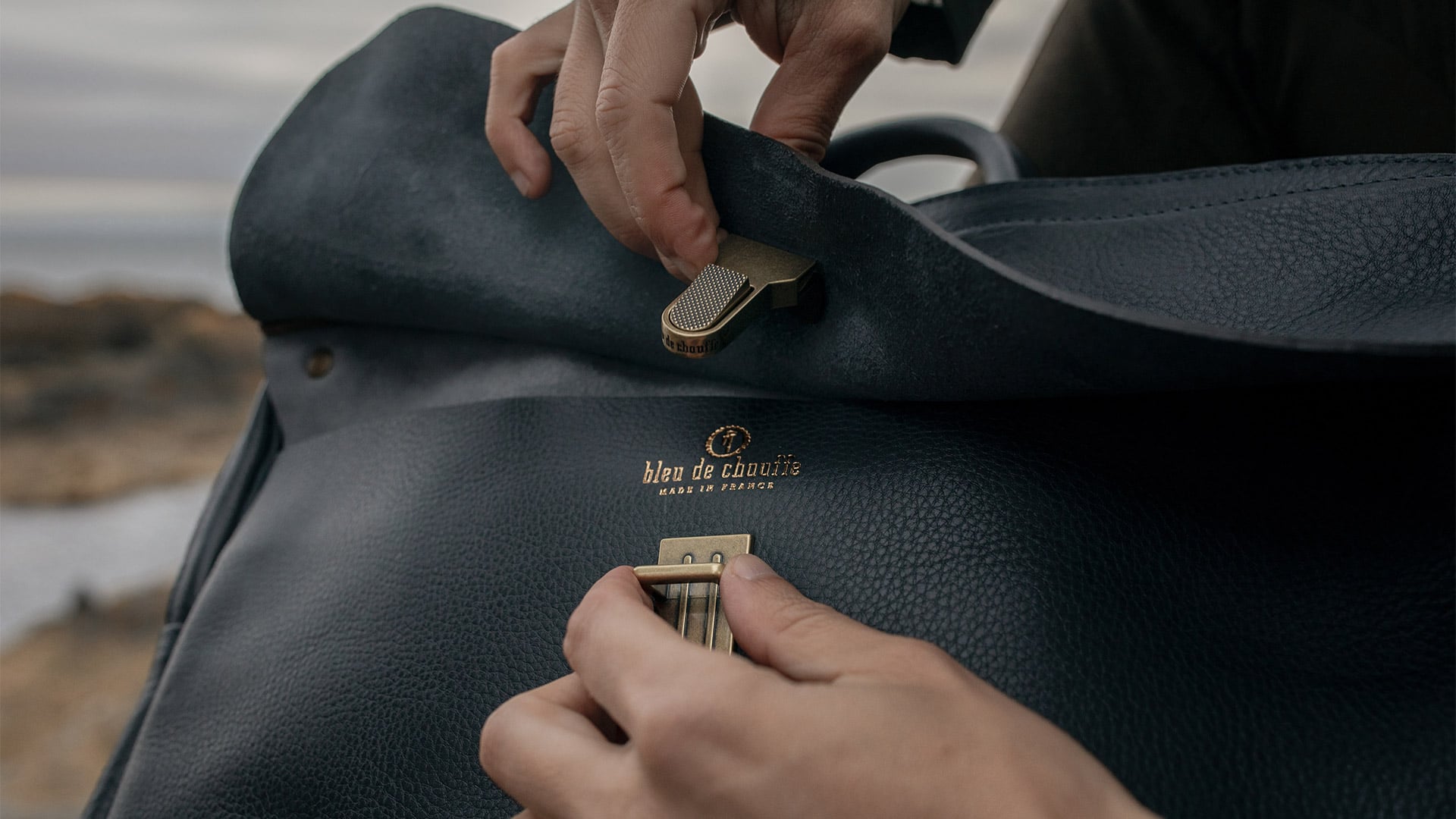 Brass fastener attached to Zeppo business bag flap
