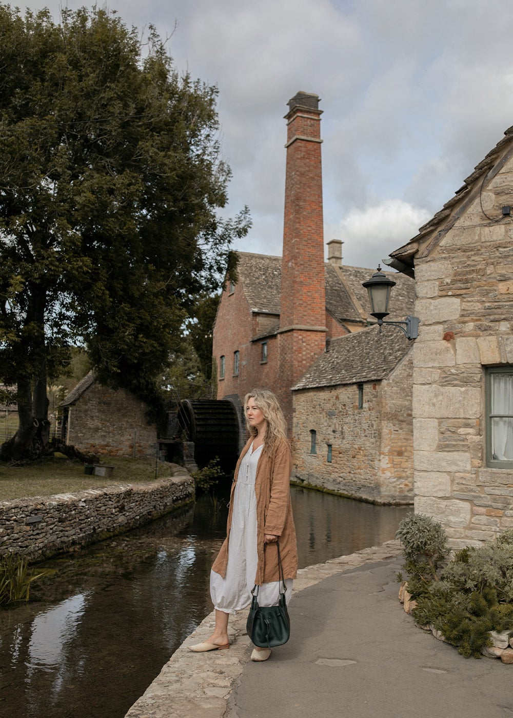 The Diane bucket bag worn by a woman