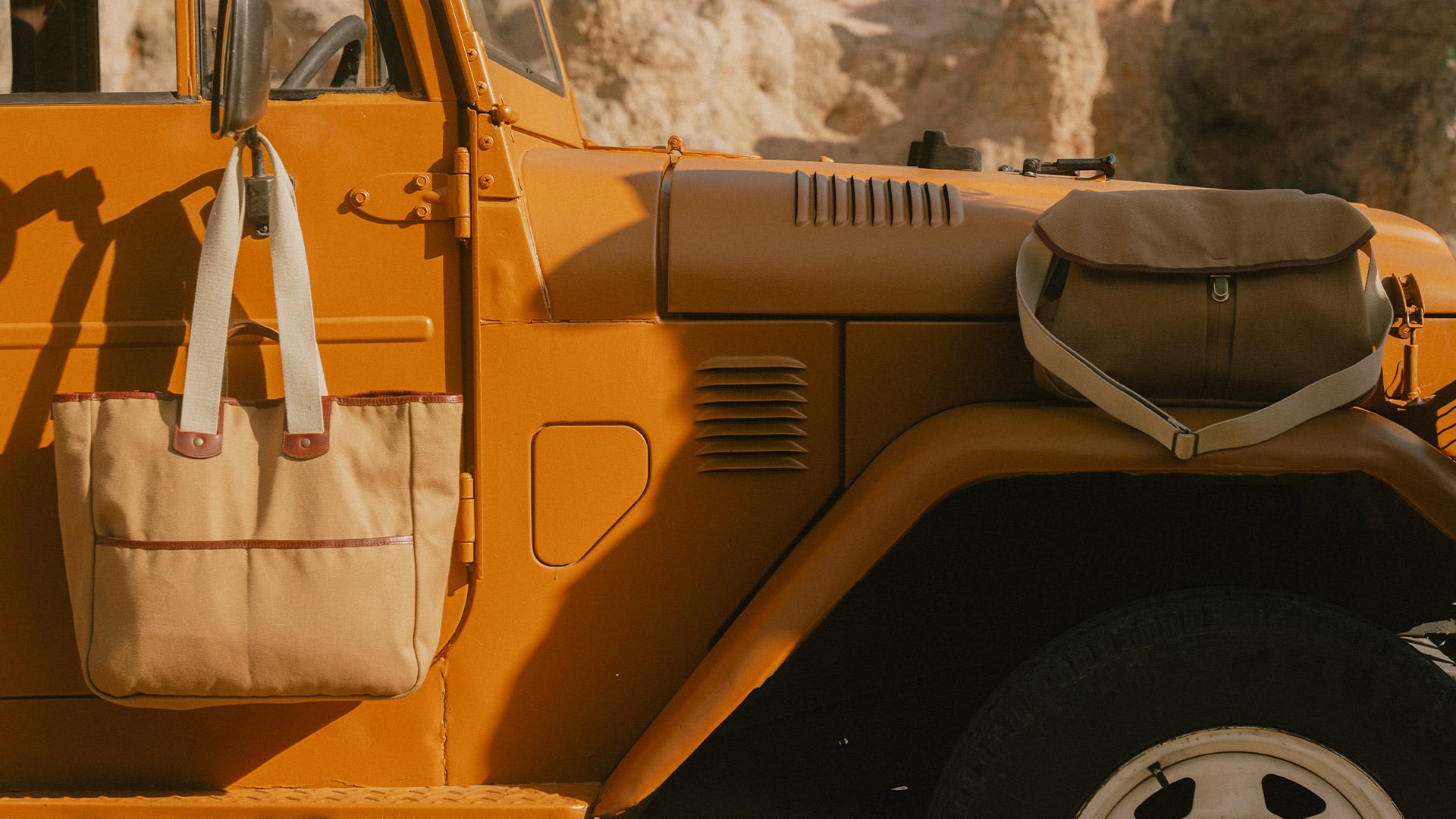 Bleu de Chauffe outdoor bags placed on a jeep.